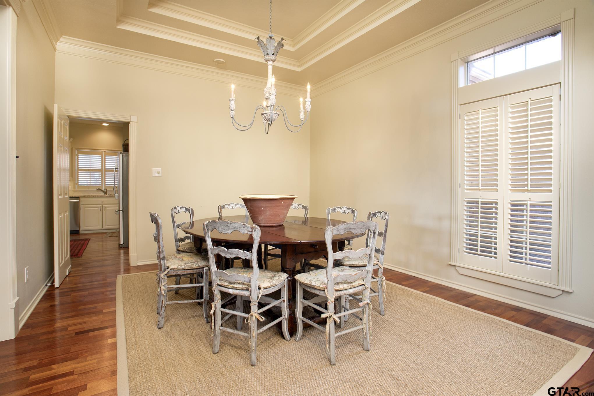 1418 Hollytree Place Tyler, TX 75703 - Photo 6 of 46 a view of a dining room with furniture and wooden floor