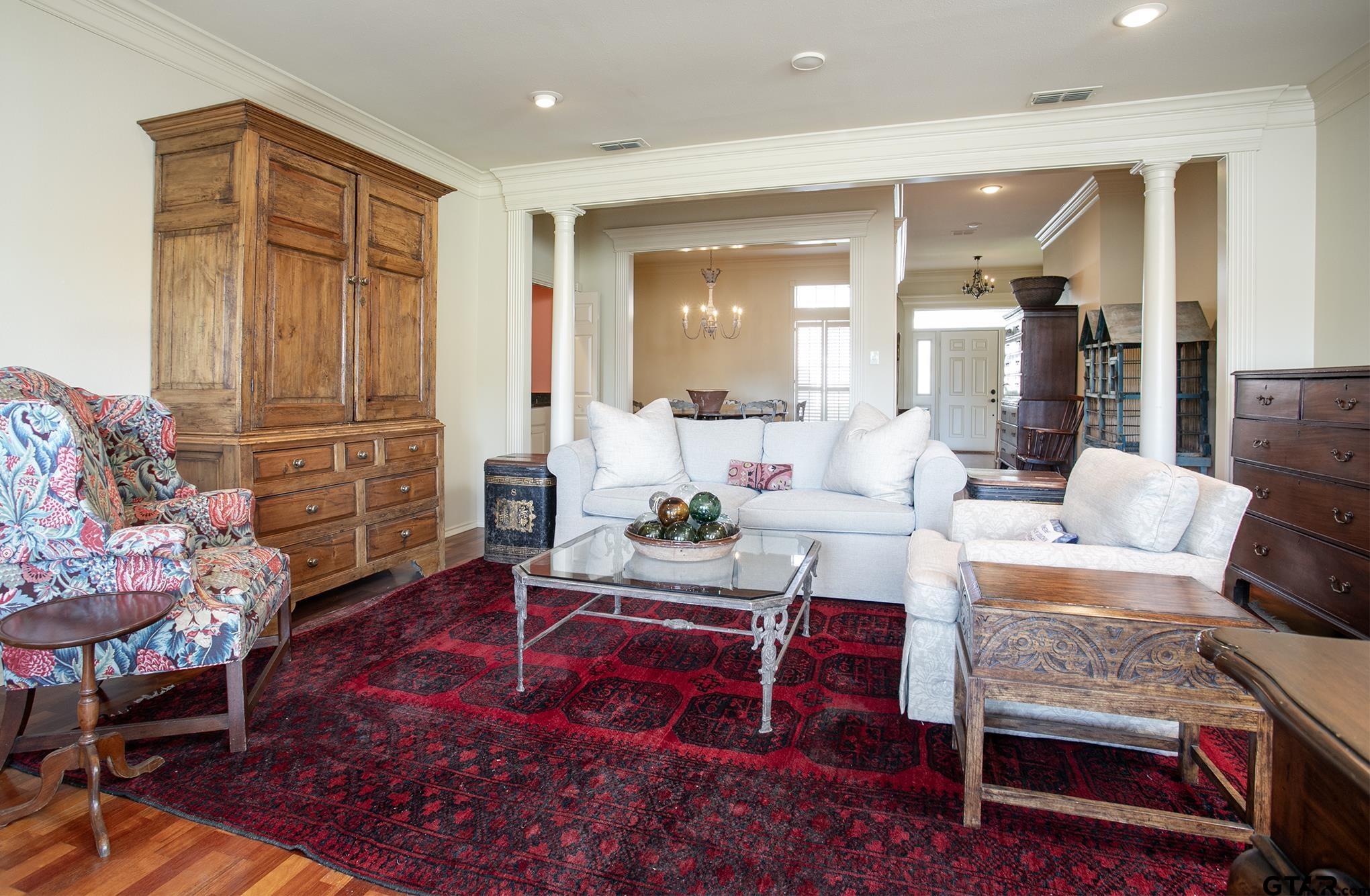 1418 Hollytree Place Tyler, TX 75703 - Photo 8 of 46 a living room with furniture and wooden floor