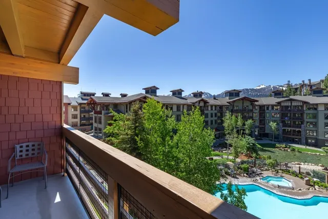a view of balcony with a yard and outdoor seating
