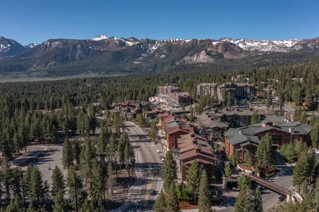 a view of a city with mountains in the background