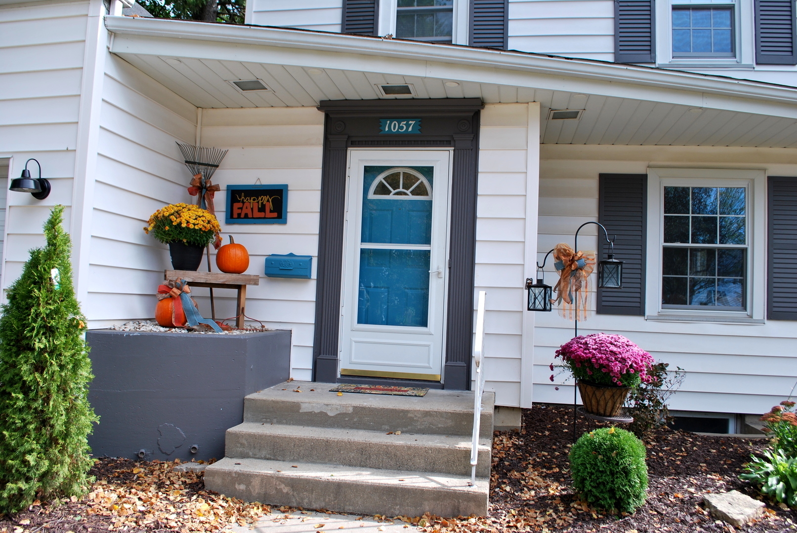 1057 North 8th Street Rochelle, IL 61068 - Photo 3 of 46 a front view of a multi story building with potted plants