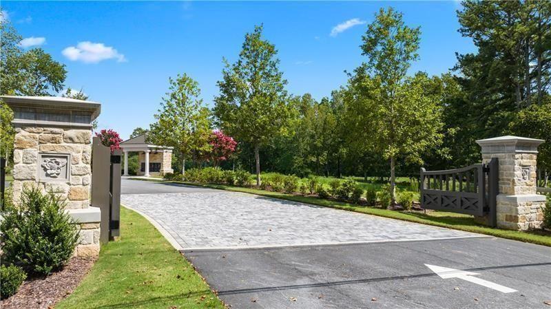 2060 Magnolia Lane Milton, GA 30004 - Photo 16 of 18 a pathway of a house with a yard
