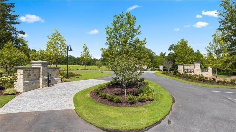 2060 Magnolia Lane Milton, GA 30004 - Photo 17 of 18 a swimming pool with outdoor seating and yard