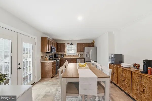 a kitchen with a sink stove and refrigerator