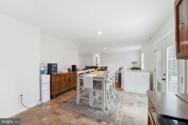a spacious bedroom with a bed and a chandelier