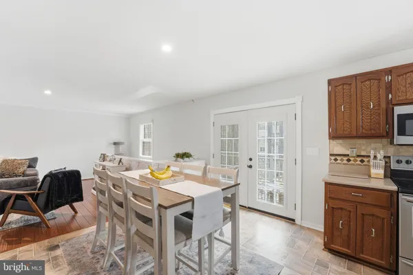 a spacious bedroom with a bed and a chandelier