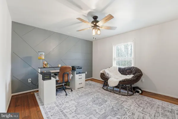 a bathroom with a sink a toilet and shower curtain