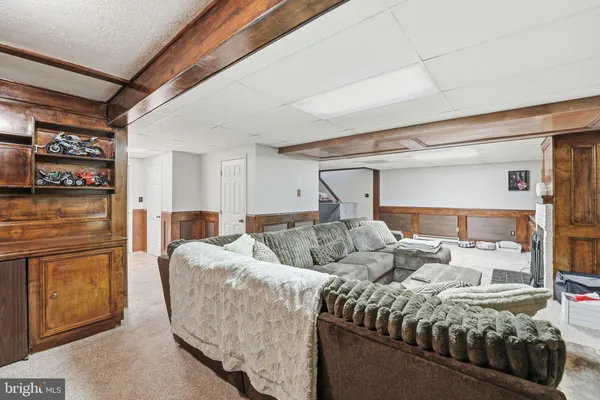 a bathroom with a sink toilet and a mirror