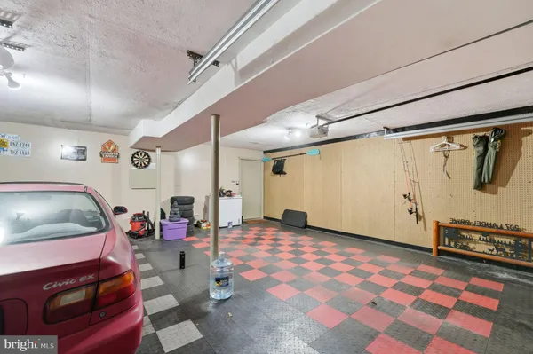 a view of a house with wooden fence