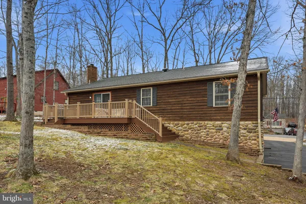 a front view of a house with stairs