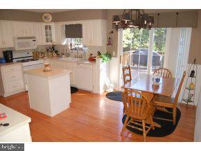 101 Toggle Road Manahawkin, NJ 08050 - Photo 5 of 12 a view of kitchen with cabinets and wooden floor