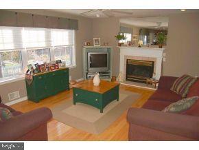 101 Toggle Road Manahawkin, NJ 08050 - Photo 6 of 12 a living room with furniture and a fireplace