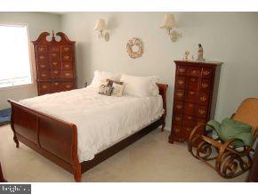 101 Toggle Road Manahawkin, NJ 08050 - Photo 8 of 12 a bedroom with a bed and a closet