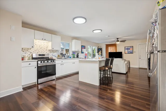 a kitchen with a sink and a refrigerator