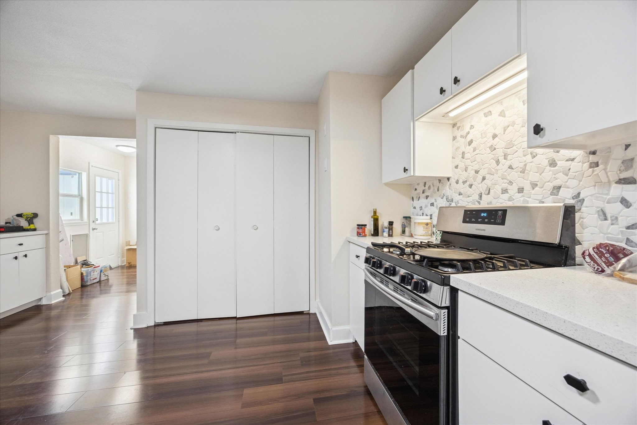 907 East 53rd Street Austin, TX 78751 - Photo 14 of 33 a kitchen with a stove and a wooden floors