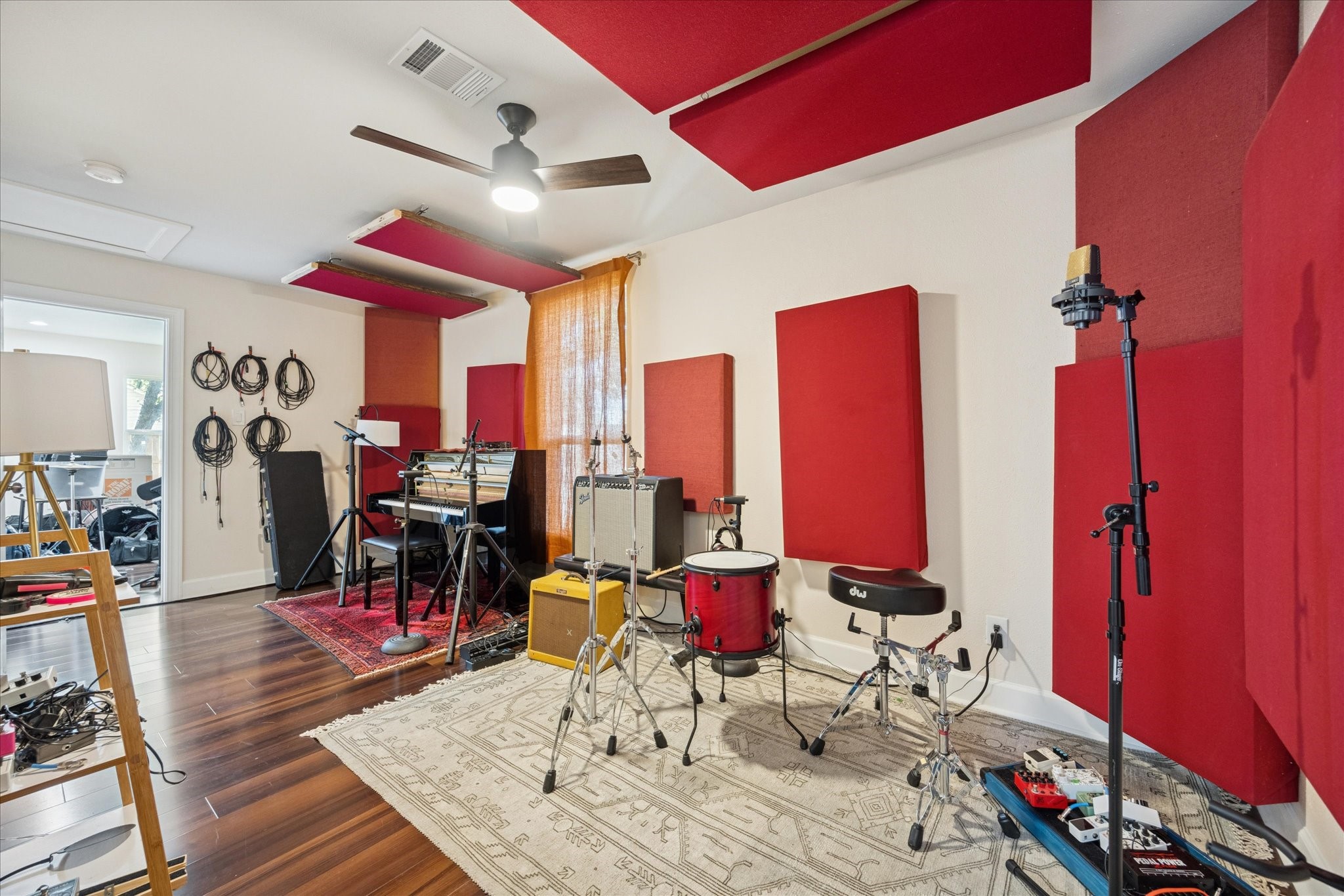 907 East 53rd Street Austin, TX 78751 - Photo 19 of 33 a living room with furniture a rug and a chandelier