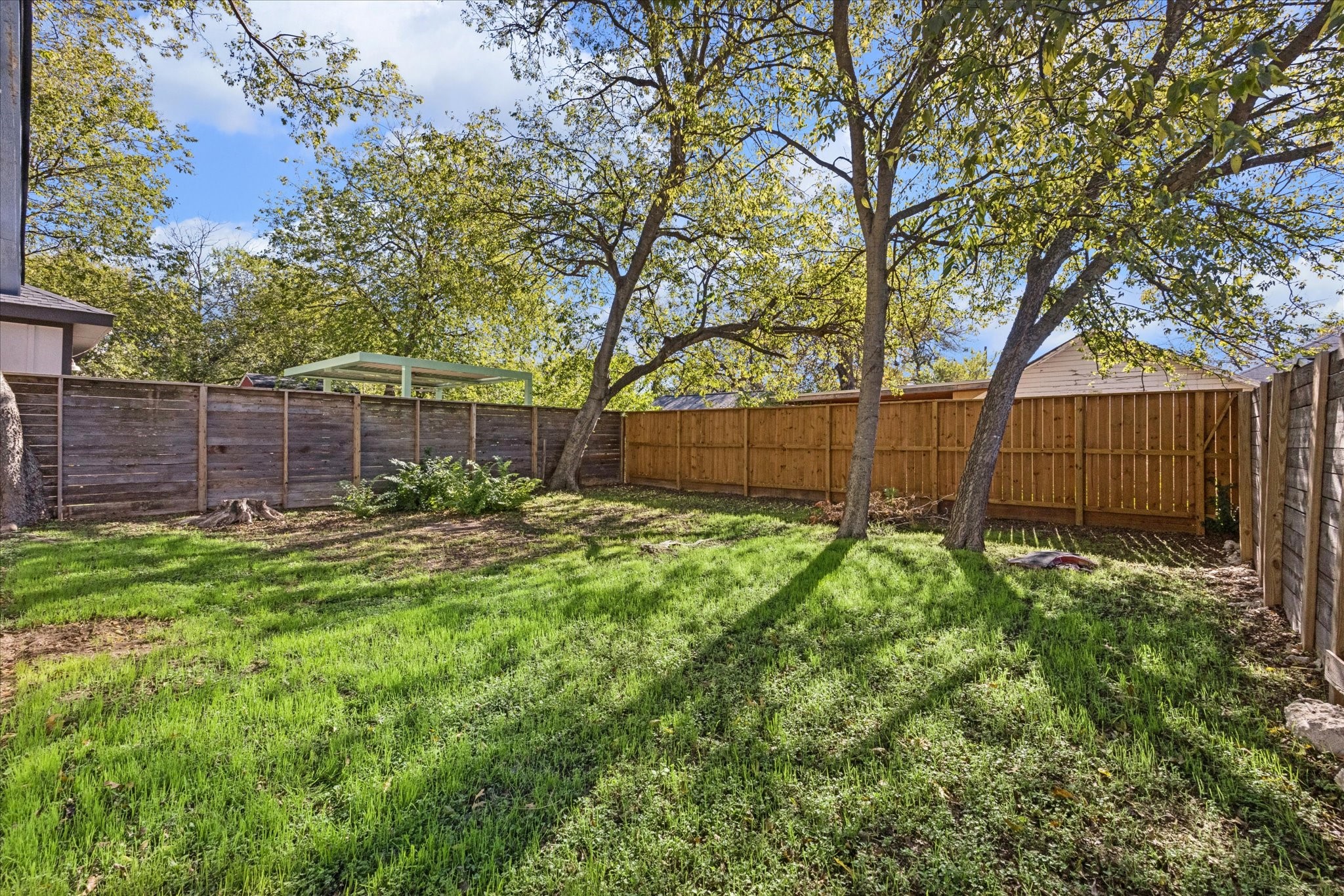 907 East 53rd Street Austin, TX 78751 - Photo 30 of 33 a view of backyard with wooden fence