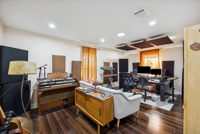 a living room with furniture fireplace and a flat screen tv