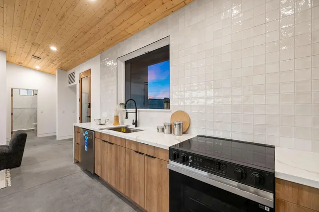 a kitchen with a stove and a sink