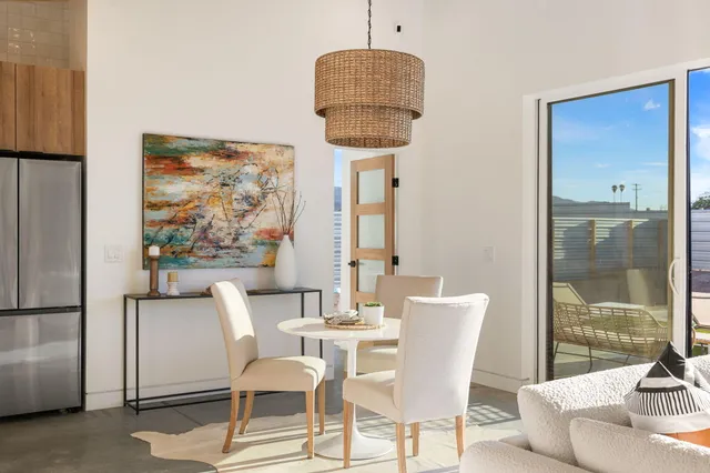 a dining room with furniture and window