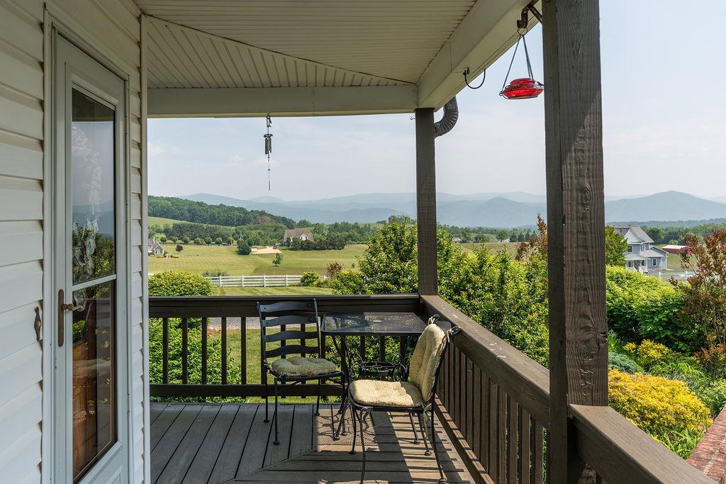 150 Ridgemore Drive Raphine, VA 24472 - Photo 5 of 75 a view of a balcony with wooden floor & fence