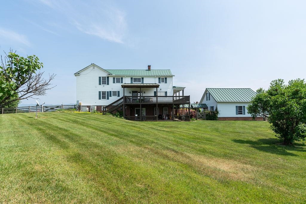 150 Ridgemore Drive Raphine, VA 24472 - Photo 59 of 75 a front view of a house with a garden and trees
