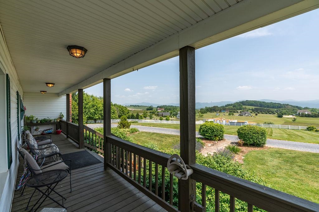150 Ridgemore Drive Raphine, VA 24472 - Photo 6 of 75 a view of a porch with furniture and garden