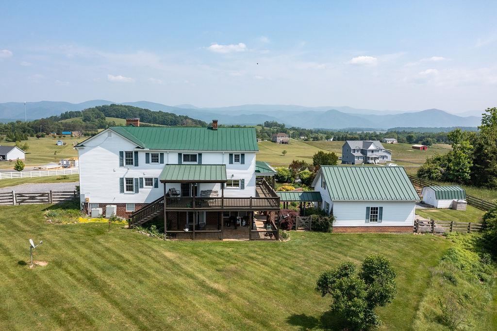 150 Ridgemore Drive Raphine, VA 24472 - Photo 69 of 75 a view of a big house with a big yard and large tree