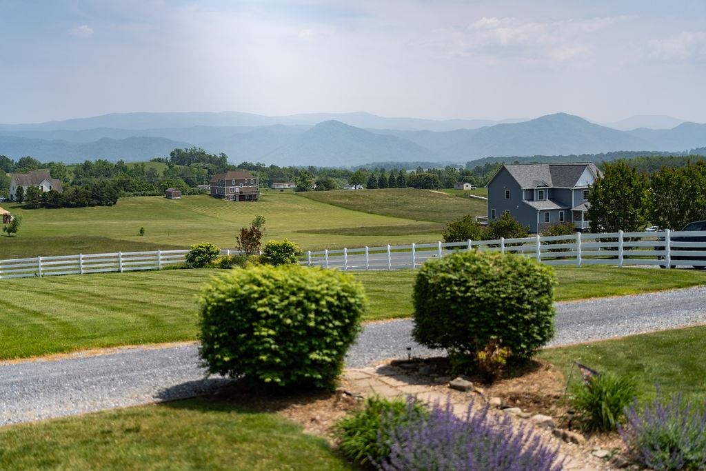 150 Ridgemore Drive Raphine, VA 24472 - Photo 72 of 75 a view of a lake with a mountain in the background