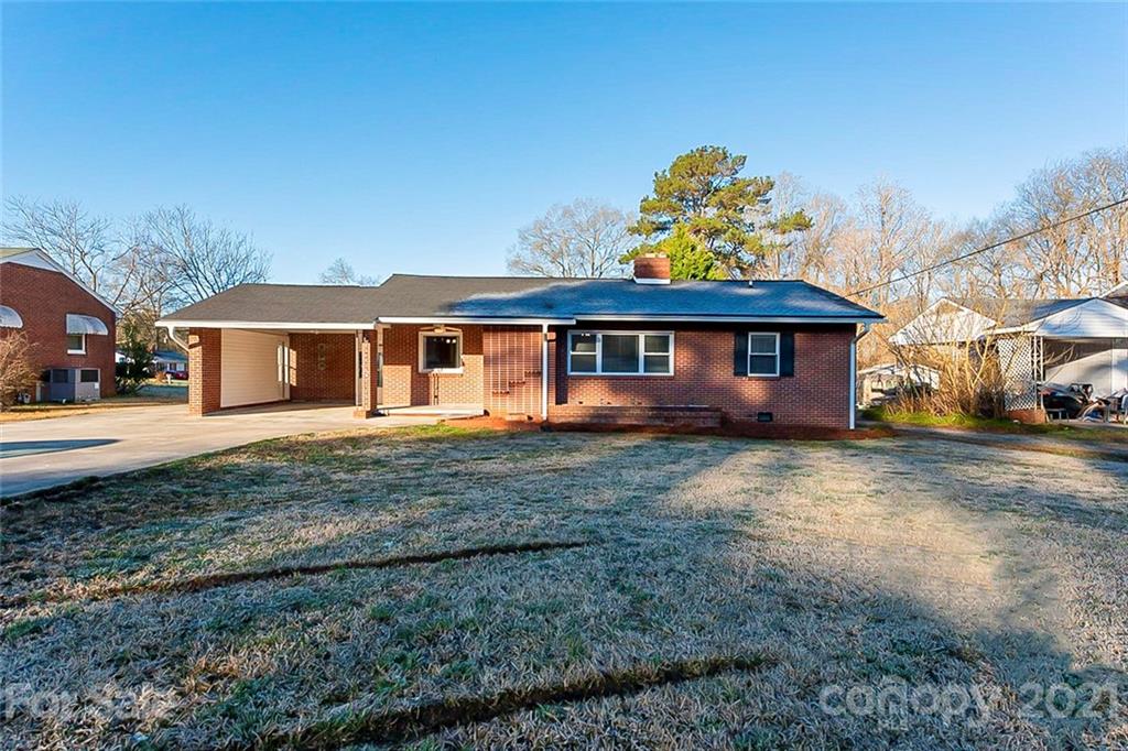 1054 Memorial Park Road Lancaster, SC 29720 - Photo 1 of 18 a front view of a house with a yard