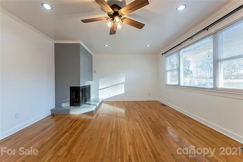1054 Memorial Park Road Lancaster, SC 29720 - Photo 5 of 18 a view of empty room with wooden floor and fan
