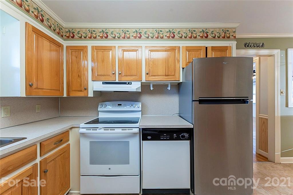 1054 Memorial Park Road Lancaster, SC 29720 - Photo 8 of 18 a kitchen with a refrigerator and a sink