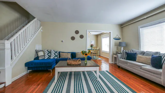 a living room with furniture and a rug