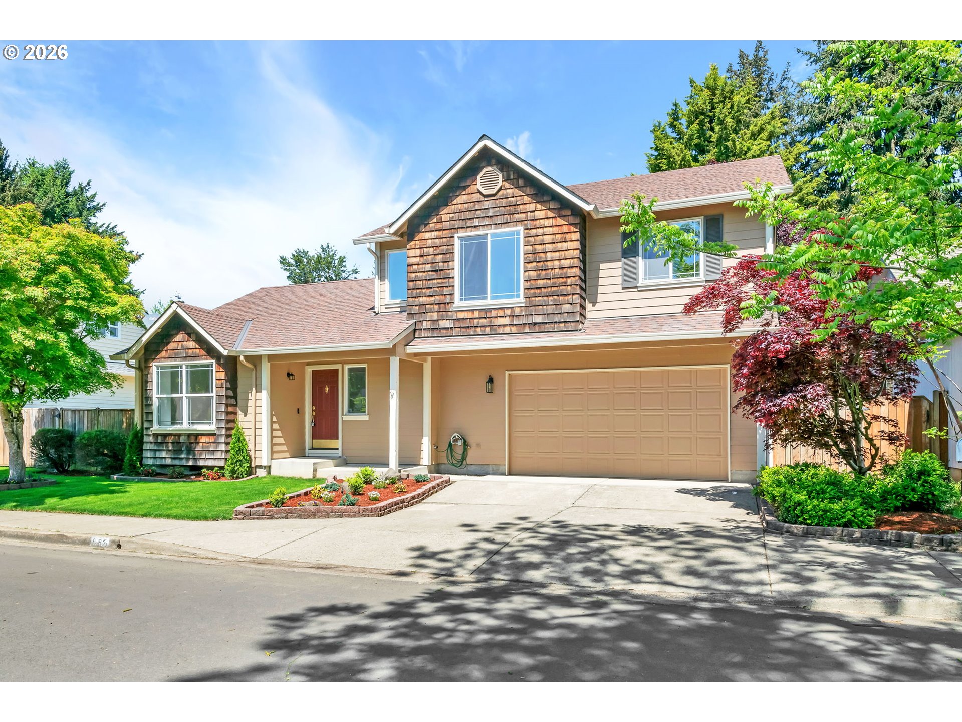 585 Dublin Avenue Eugene, OR 97404 - Photo 1 of 32 a front view of a house with a yard and garage