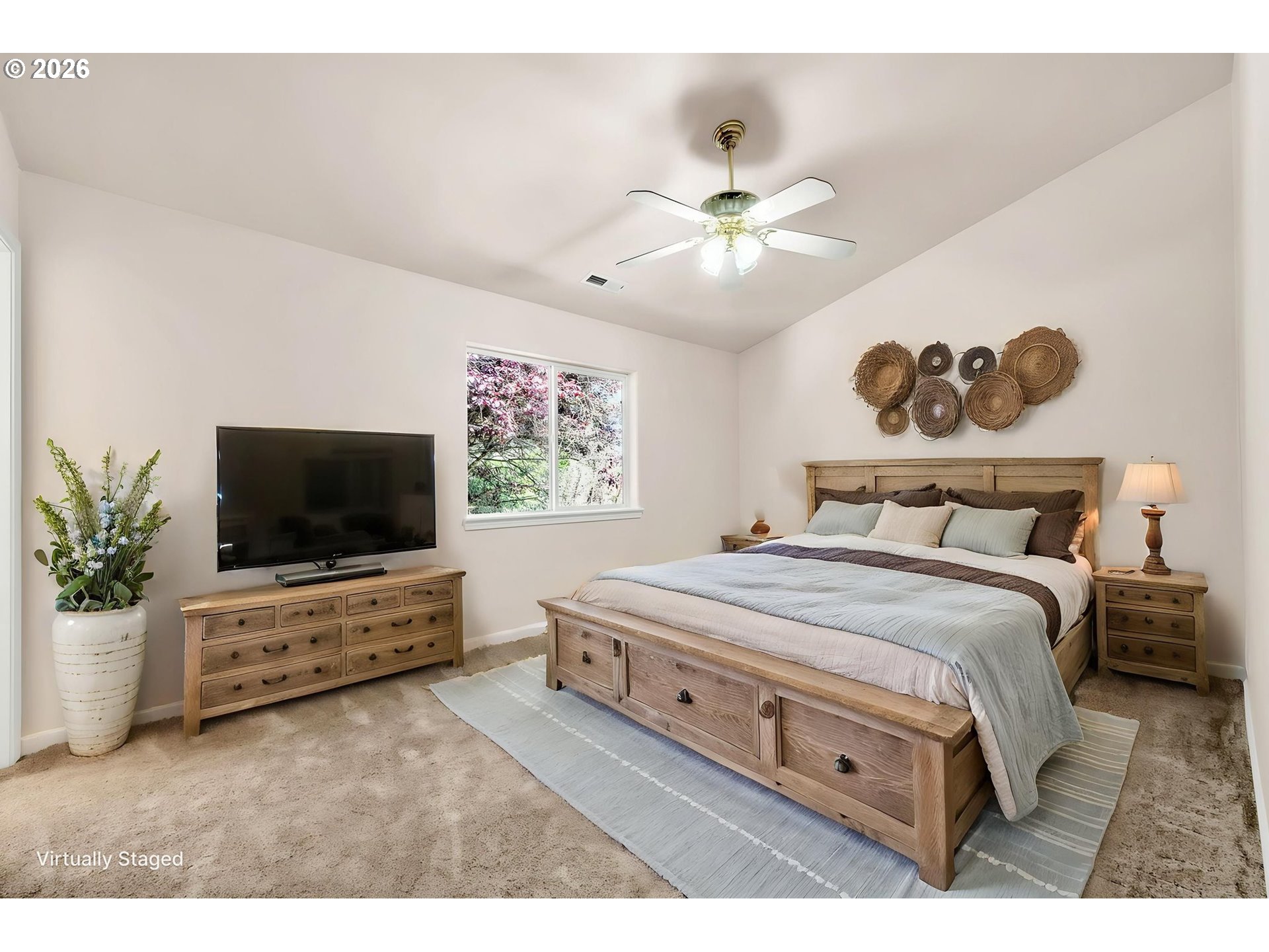 585 Dublin Avenue Eugene, OR 97404 - Photo 17 of 32 a bedroom with a bed and a flat screen tv