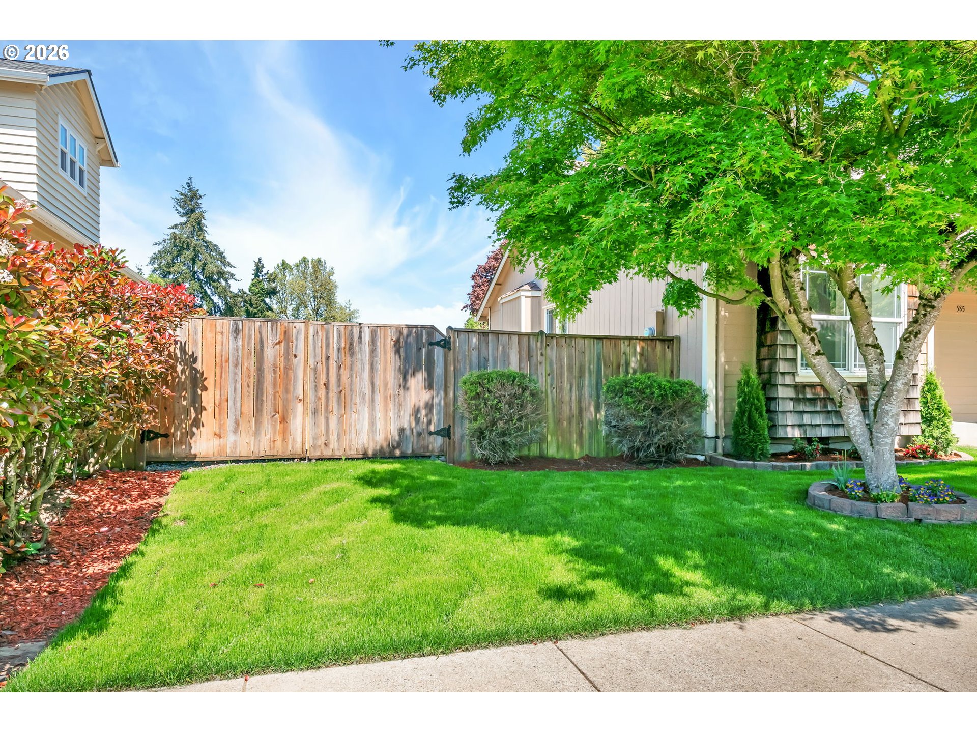 585 Dublin Avenue Eugene, OR 97404 - Photo 2 of 32 a view of a backyard with a garden