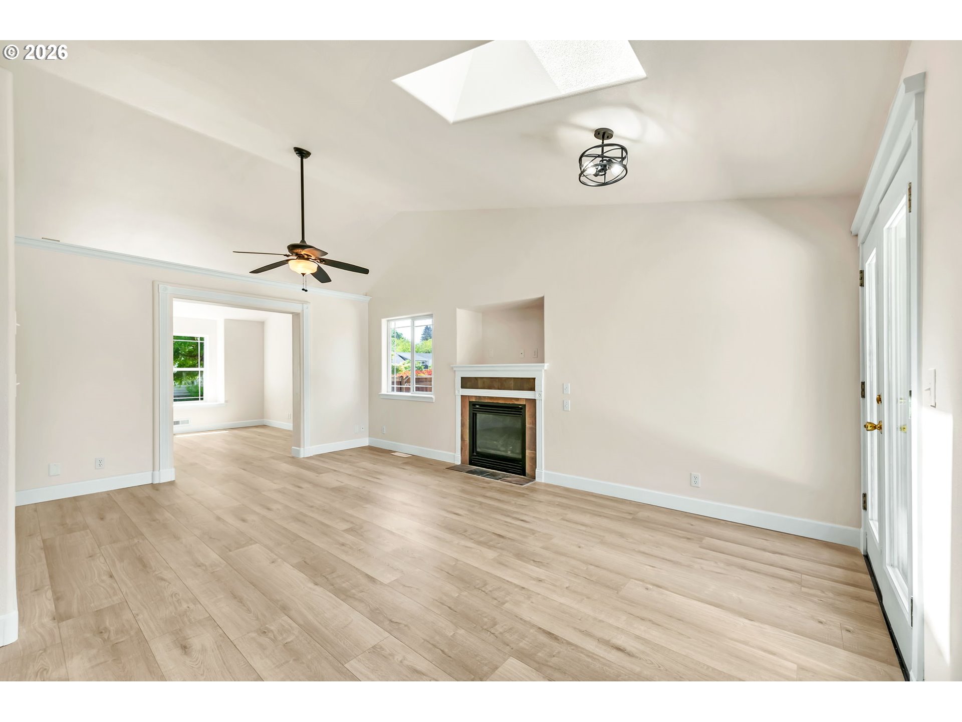 585 Dublin Avenue Eugene, OR 97404 - Photo 6 of 32 a view of empty room with wooden floor and fireplace