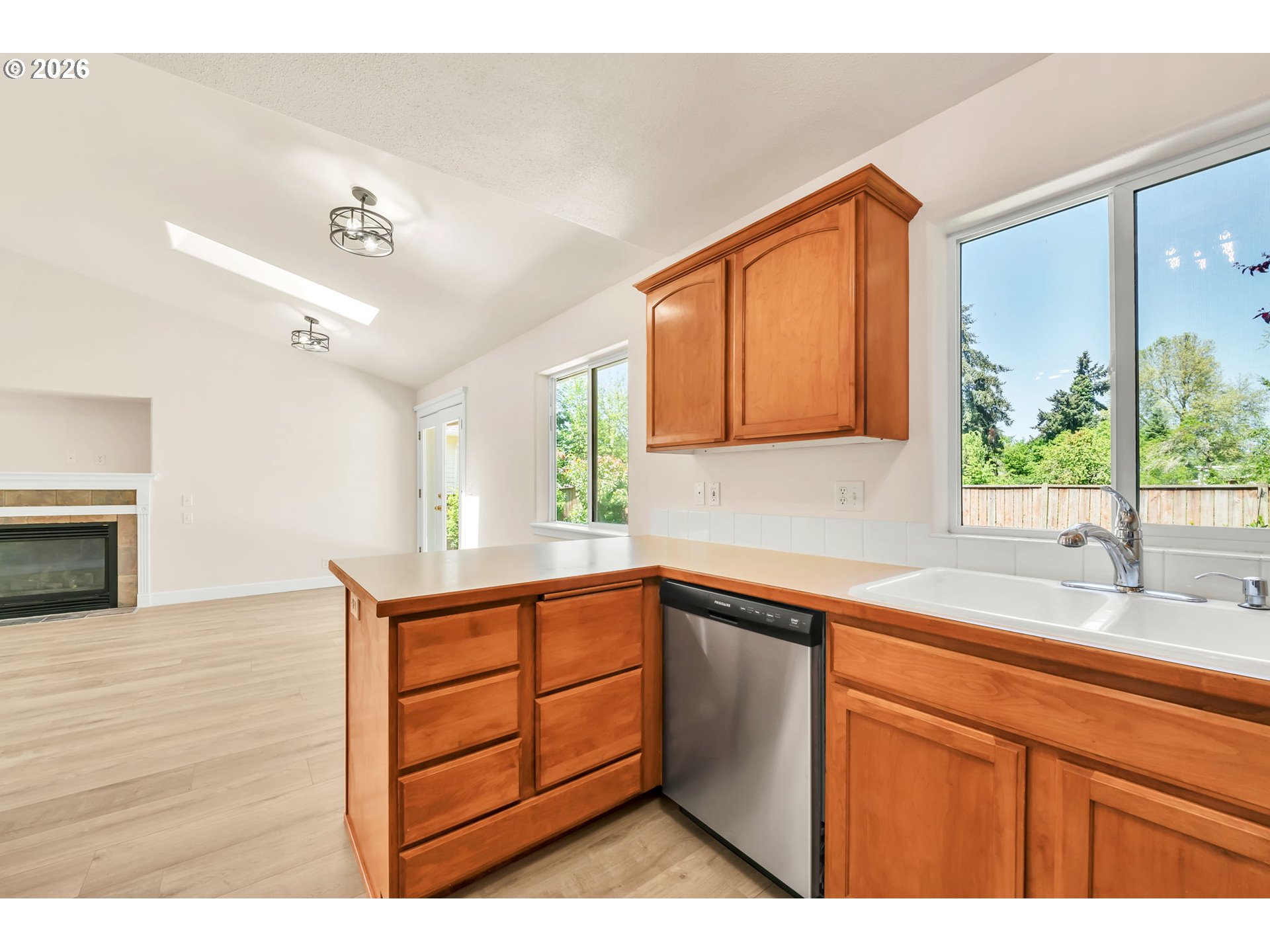 585 Dublin Avenue Eugene, OR 97404 - Photo 9 of 32 a kitchen with a sink cabinets and window