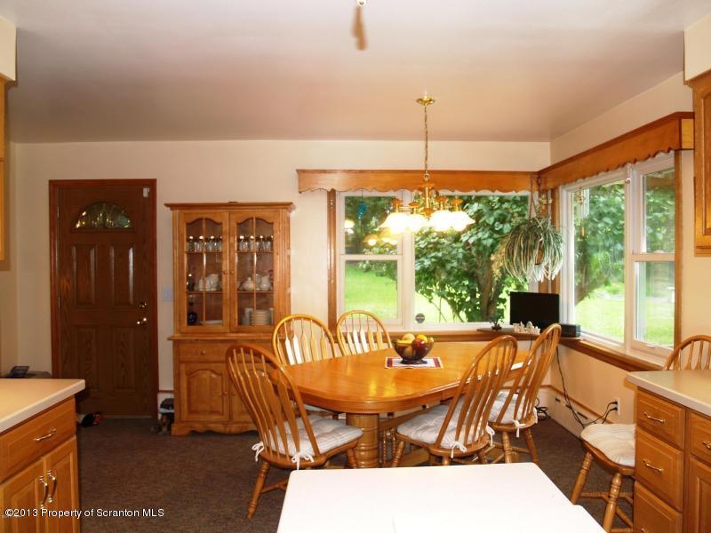 1221 Mt Cobb Road Lake Ariel, PA 18436 - Photo 5 of 29 a view of a dining room with furniture window and outside view