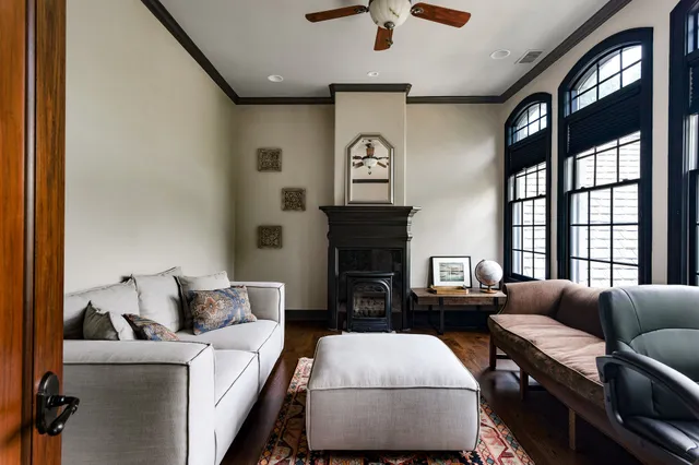 a living room with furniture and a fireplace