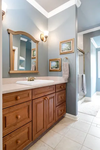 a bathroom with a sink and a mirror