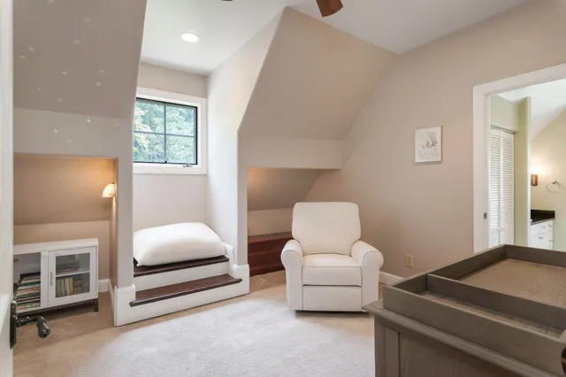 a bedroom with furniture and a window