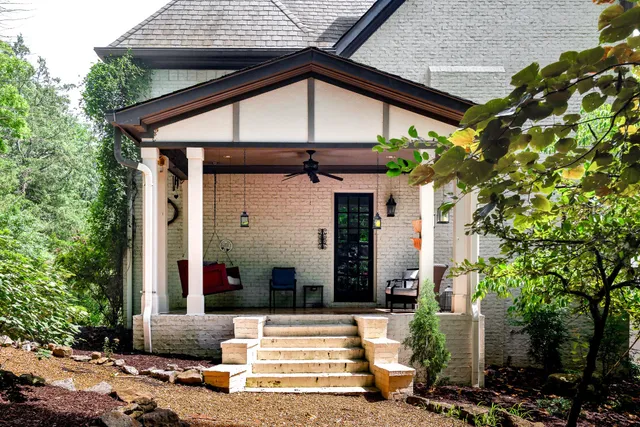 a front view of a house with garden