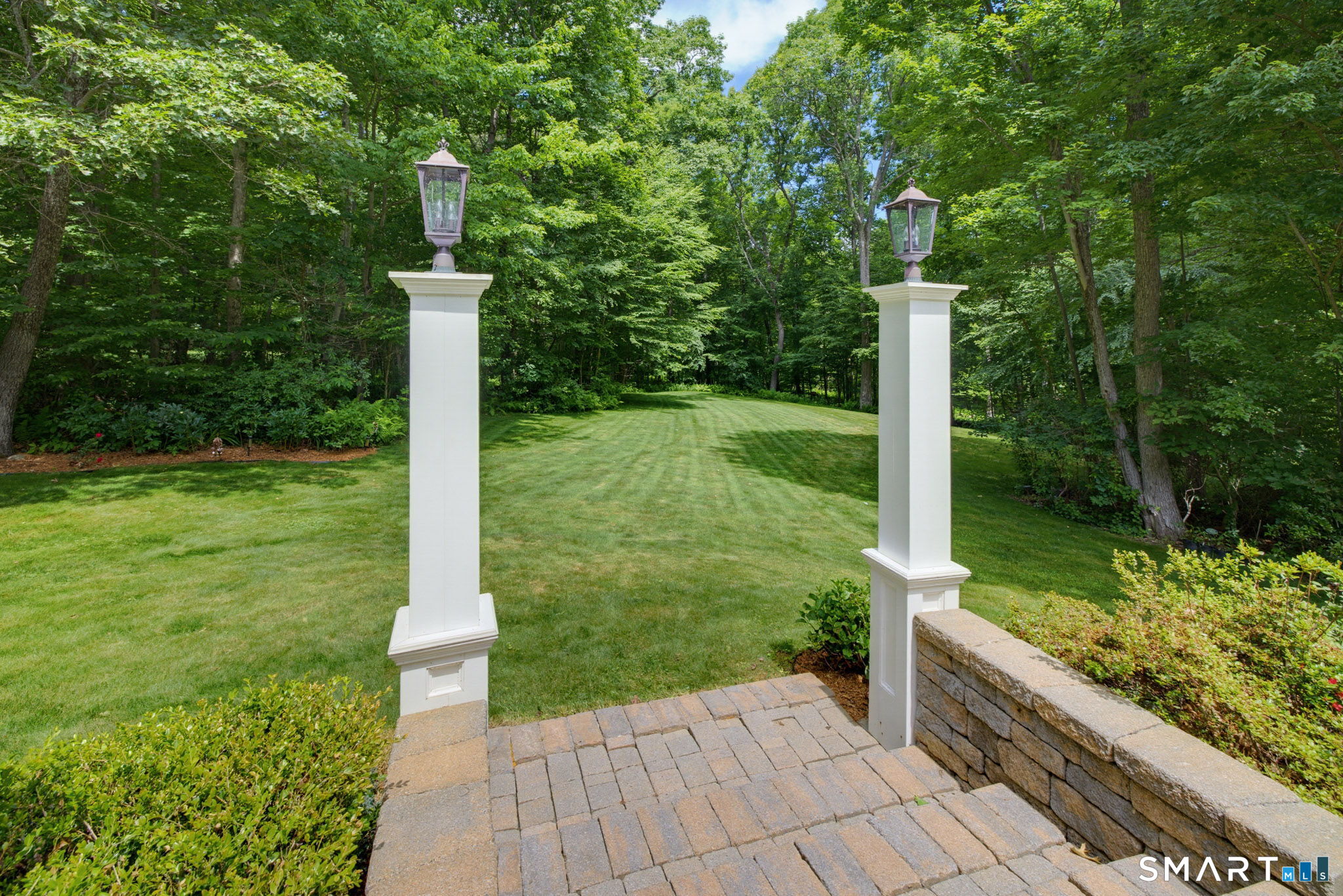 158 Appian Way Coventry, CT 06238 - Photo 5 of 40 a view of a garden with small fountain