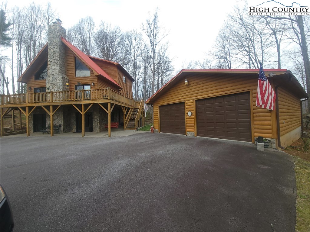 a view of a house with a yard and garage