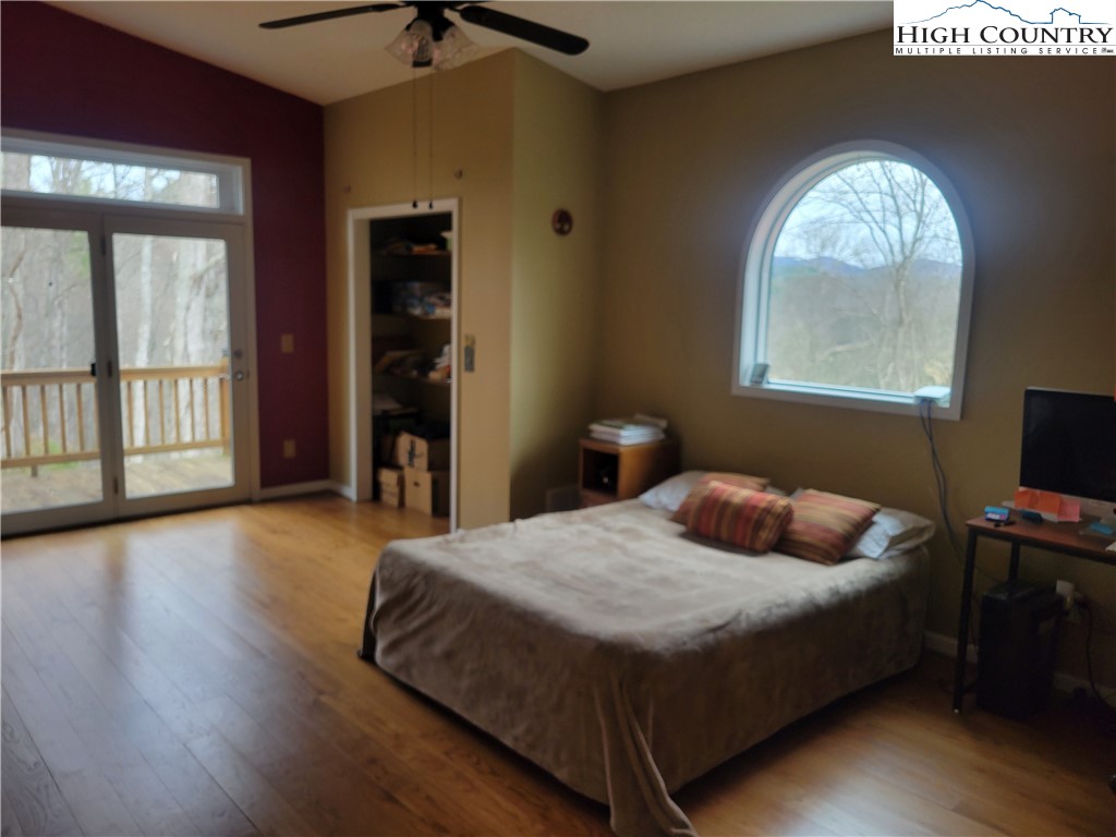 1729 Cranberry Creek Road Laurel Springs, NC 28644 - Photo 11 of 26 a bedroom with a bed and a window