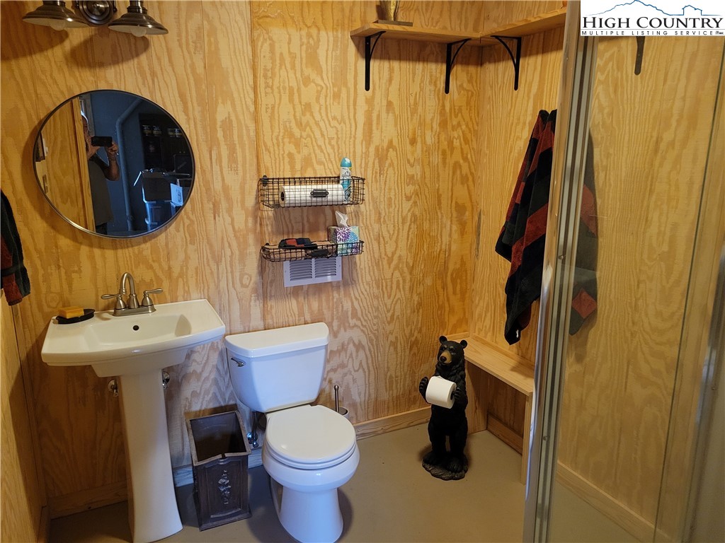 1729 Cranberry Creek Road Laurel Springs, NC 28644 - Photo 14 of 26 a bathroom with a toilet and a sink