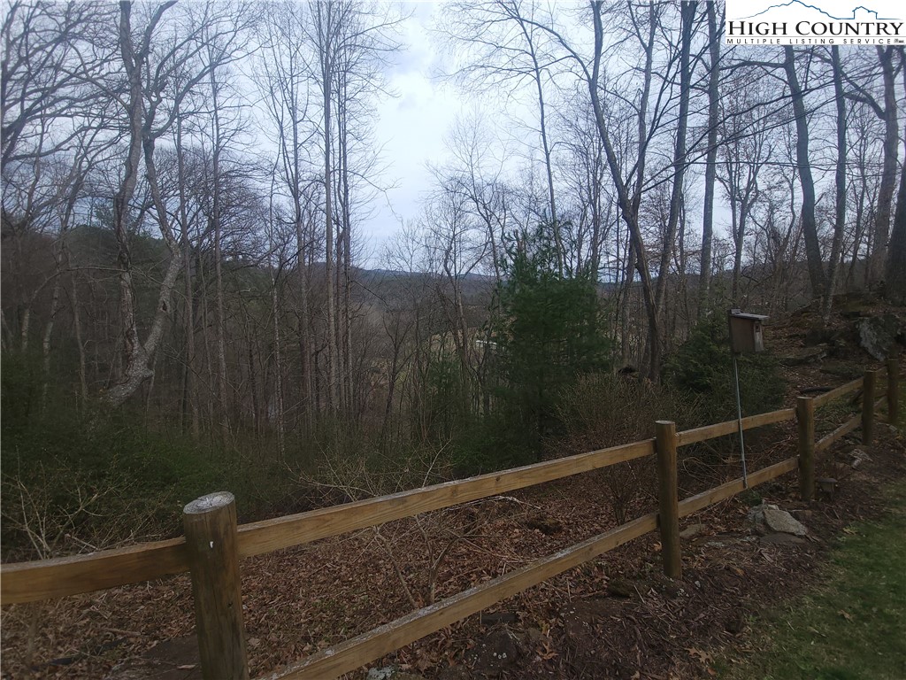 1729 Cranberry Creek Road Laurel Springs, NC 28644 - Photo 21 of 26 a view of a wooden fence and trees