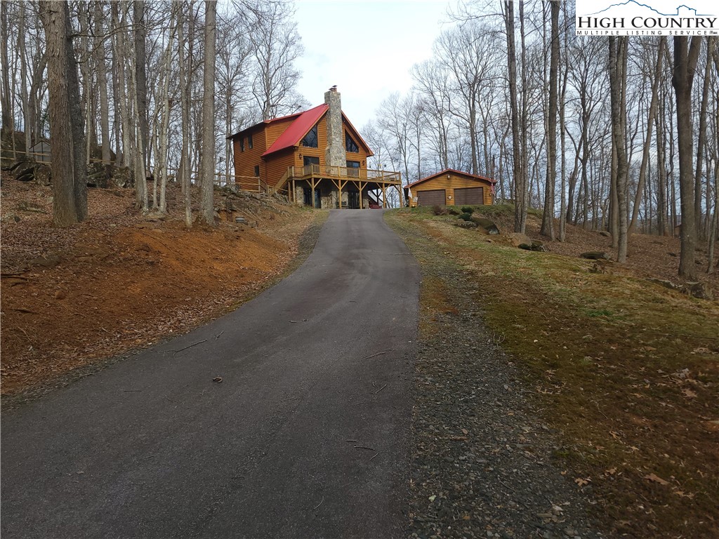 1729 Cranberry Creek Road Laurel Springs, NC 28644 - Photo 26 of 26 a view of house with outdoor space and street view