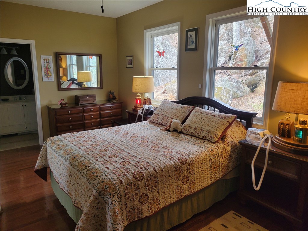 1729 Cranberry Creek Road Laurel Springs, NC 28644 - Photo 6 of 26 a bedroom with a bed and dresser